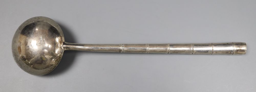 An early 20th century Chinese Export white metal ladle, with faux bamboo handle, Wing Nam & Co, 18.9cm, 40 grams.